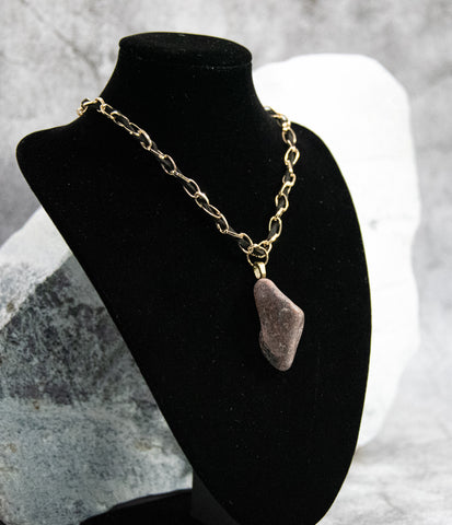 Gold and Leather Necklace with Eye-Catching Rock