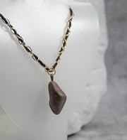 Gold and Leather Necklace with Eye-Catching Rock