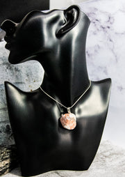 Eye-catching Canadian Shield Rock on a silver-finish snake chain