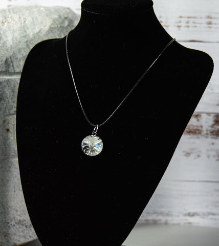 Glittering and glistening clear crystals in black-finish necklace