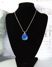 Finished and shaped Sodalite stone necklace, deep blue with multitude of cream and white accents