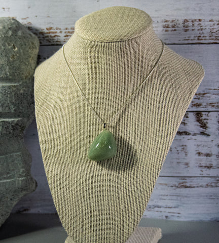 Finished and shaped light green Fluorite necklace, with subtle green and white accents