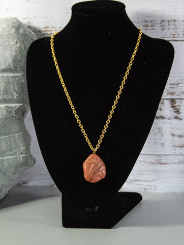 Finished and shaped red Aventurine rock necklace, with intriguing shape and cream and light brown accents