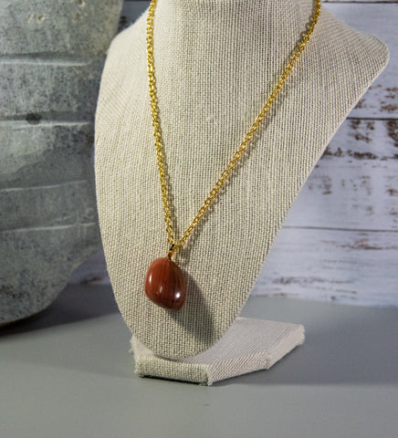 Finished and shaped Red Jasper rock necklace, light red with multitude of cream coloured intrusions and accents