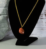 Finished and shaped Red Jasper rock necklace, light red with multitude of cream coloured intrusions and accents